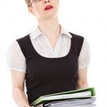 woman carrying files